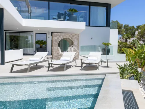 Stunning 6-bedroom minimalist villa with panoramic views of the sea and Dalt Villa, in Cap Martinet, Ibiza