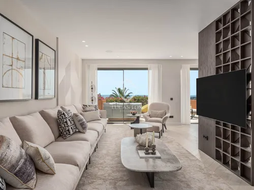 Artfully renovated 4-bedroom, 4.5-bathroom apartment in exclusive Les Belvederes, Nueva Andalucía with panoramic sea views, designer interiors and luxury amenities.